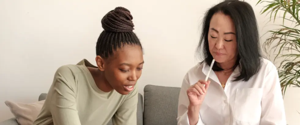 A therapist working with her patient in an appointment