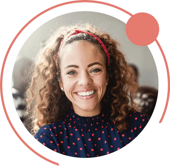 happy women with curly hair smiling at work