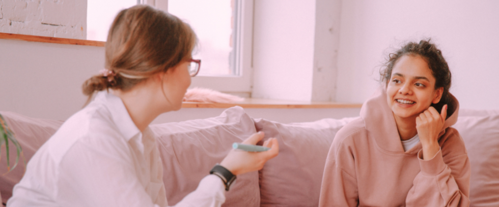 Smiling child in an appointment with her therapist