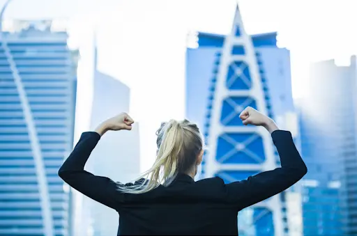 Business woman clenching her fists in frustration